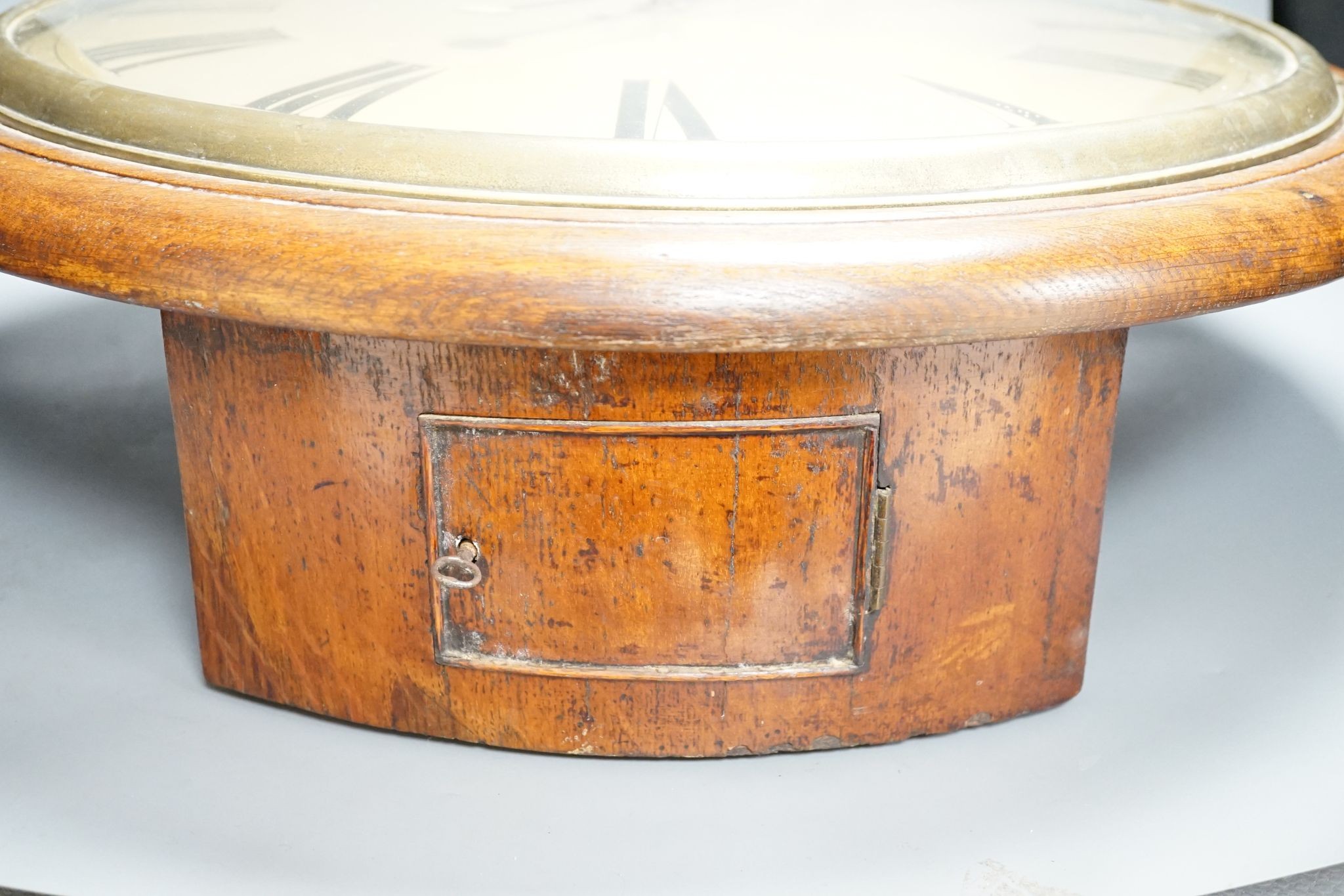 A large Victorian oak-cased dial clock, 56 cms diameter.